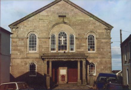 A large town chapel with round arched windows