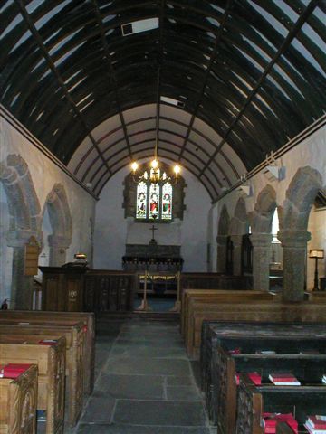 Looking up the nave towards the chancel with a small high east window