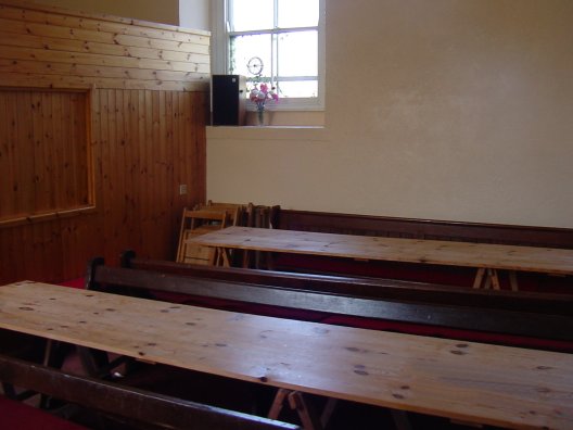 The interior of the first chapel, now used as a meeting room