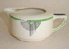 a tango gravy jug in the casino style, green