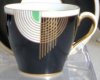 a tango coffee cup in Gold/White/Green