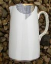 a tango water jug in black and gold